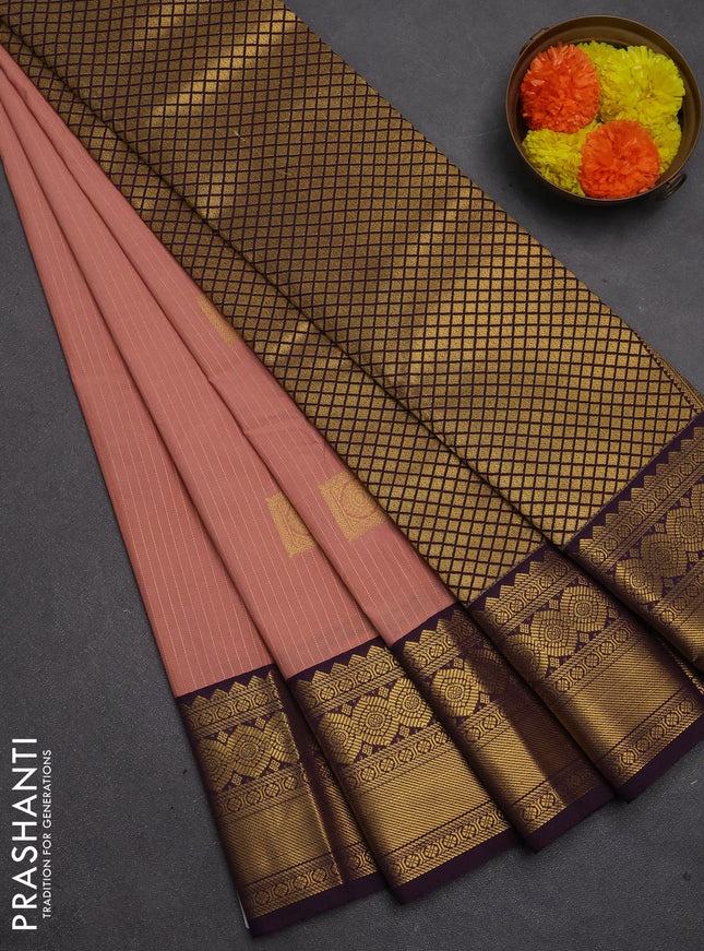 Semi kanchipuram silk saree peach pink and deep purple with allover zari weaves & buttas and temple design zari woven border
