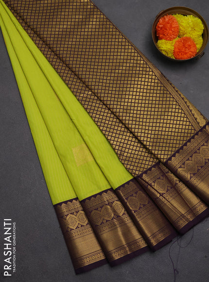 Semi kanchipuram silk saree fluorescent green and deep purple with allover zari weaves & buttas and temple design zari woven border