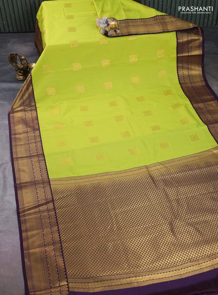 Semi kanchipuram silk saree fluorescent green and deep purple with allover zari weaves & buttas and temple design zari woven border