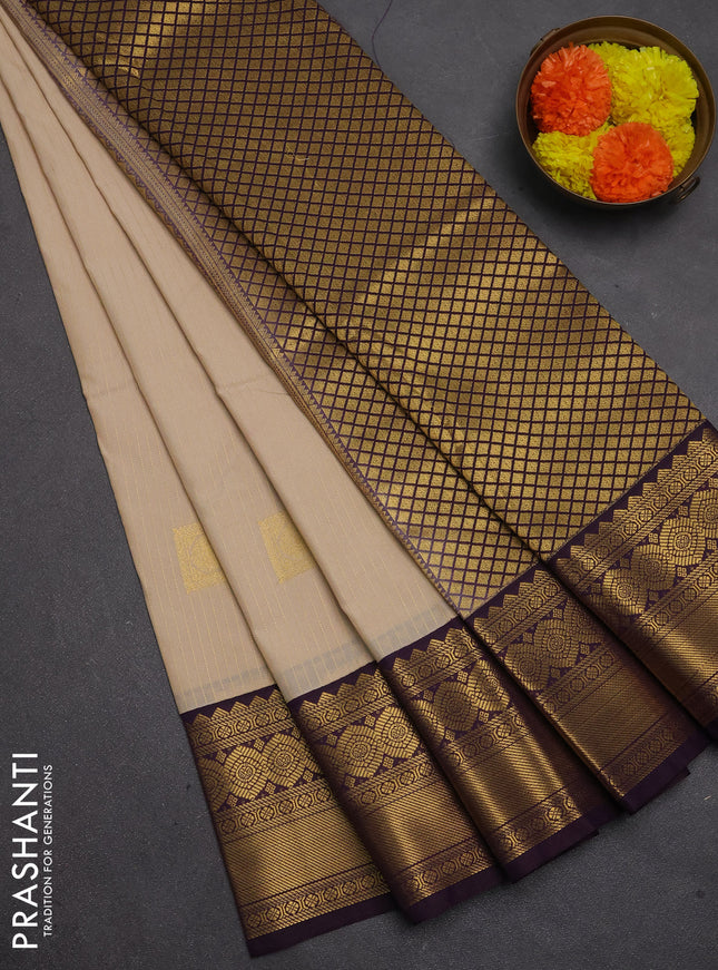 Semi kanchipuram silk saree beige and deep purple with allover zari weaves & buttas and temple design zari woven border