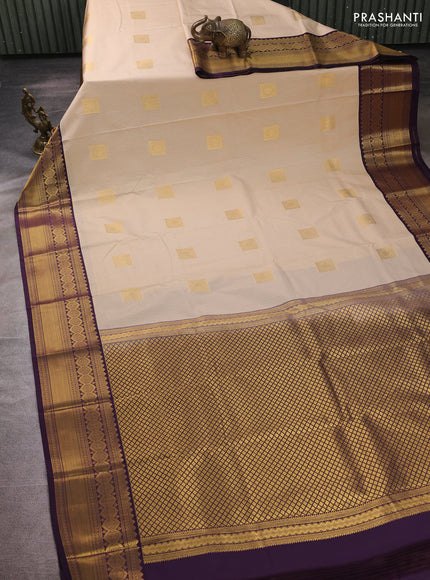 Semi kanchipuram silk saree beige and deep purple with allover zari weaves & buttas and temple design zari woven border