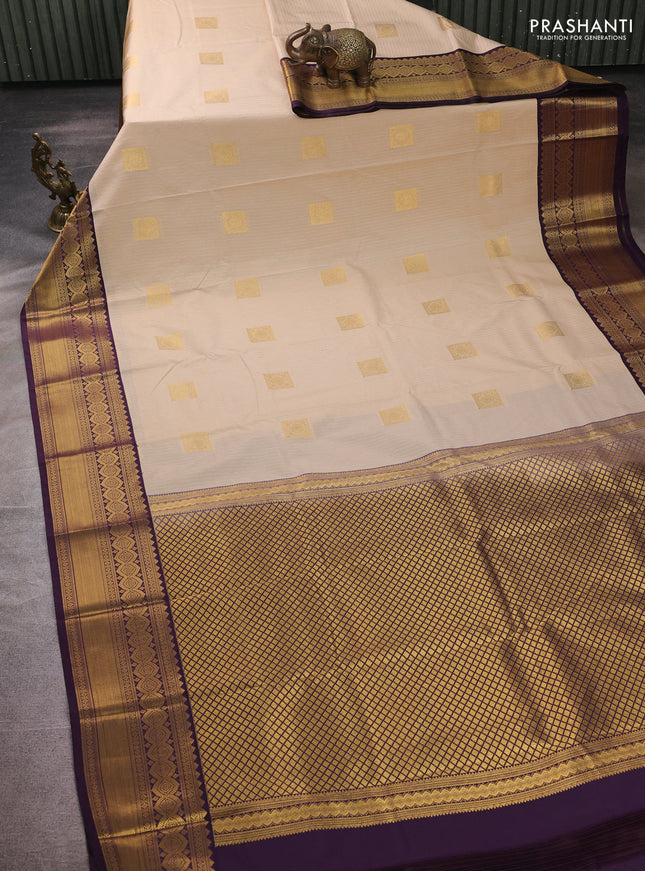 Semi kanchipuram silk saree beige and deep purple with allover zari weaves & buttas and temple design zari woven border
