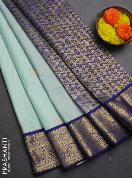 Semi kanchipuram silk saree mild teal and navy blue with allover small zari checks & buttas and zari woven korvai border