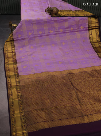 Semi kanchipuram silk saree lavender and deep purple with allover zari checks & buttas and rich rettapet zari woven korvai border
