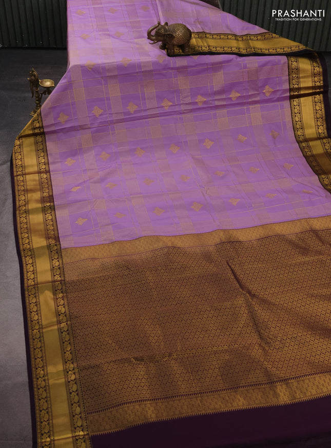 Semi kanchipuram silk saree lavender and deep purple with allover zari checks & buttas and rich rettapet zari woven korvai border