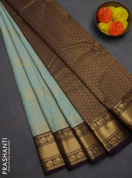 Semi kanchipuram silk saree mild teal green and deep purple with allover zari checks & buttas and rich rettapet zari woven korvai border