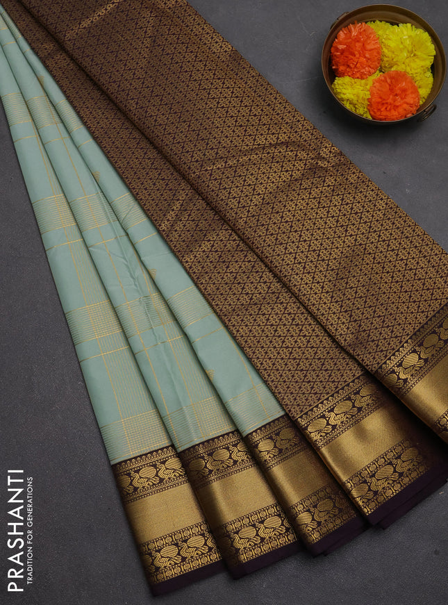 Semi kanchipuram silk saree mild teal green and deep purple with allover zari checks & buttas and rich rettapet zari woven korvai border