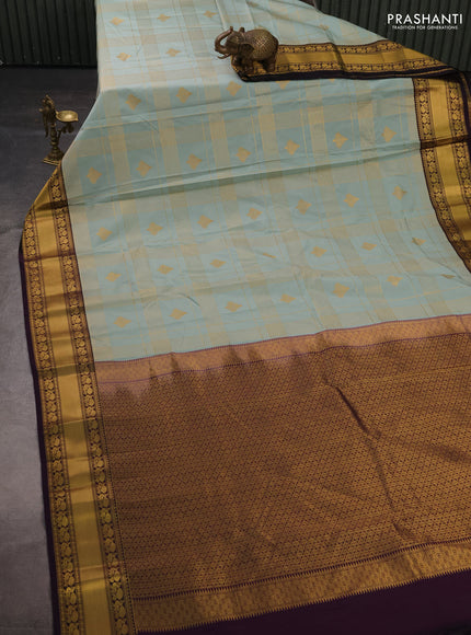 Semi kanchipuram silk saree mild teal green and deep purple with allover zari checks & buttas and rich rettapet zari woven korvai border