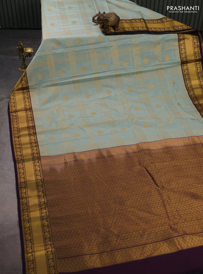 Semi kanchipuram silk saree mild teal green and deep purple with allover zari checks & buttas and rich rettapet zari woven korvai border