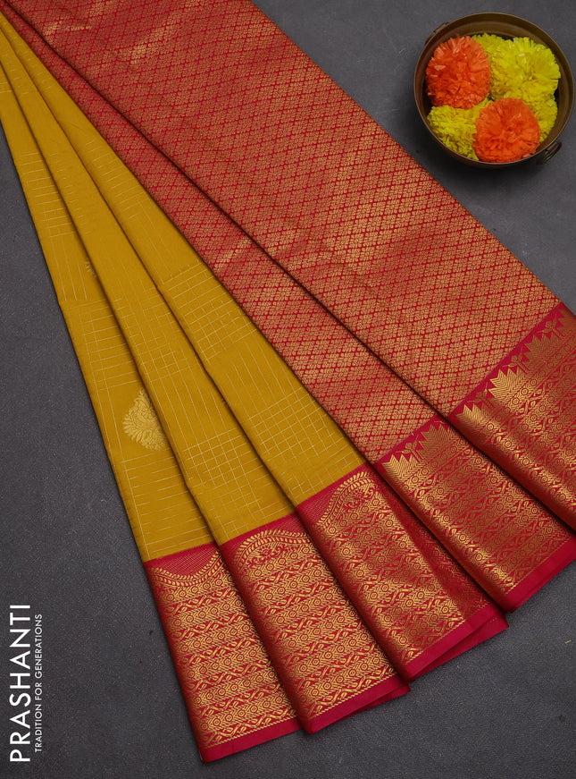 Semi kanchipuram silk saree mustard yellow and pink with allover zari checks & buttas and zari woven korvai border