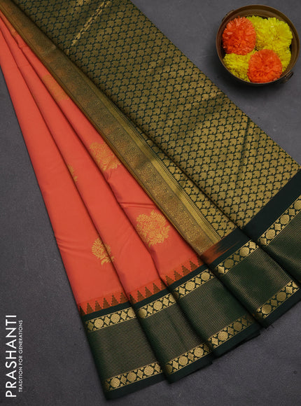 Semi kanchipuram silk saree peach shade and bottle green with zari woven buttas and temple design zari woven border