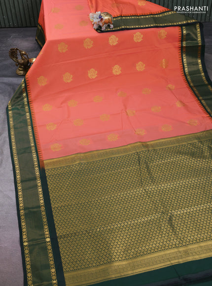 Semi kanchipuram silk saree peach shade and bottle green with zari woven buttas and temple design zari woven border