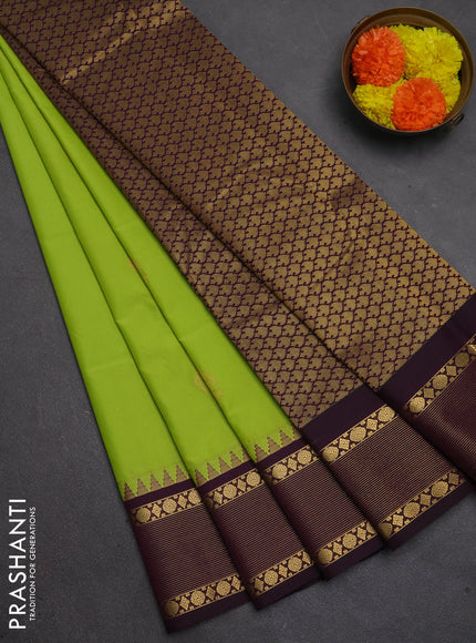 Semi kanchipuram silk saree light green and deep purple with zari woven buttas and temple design zari woven korvai border