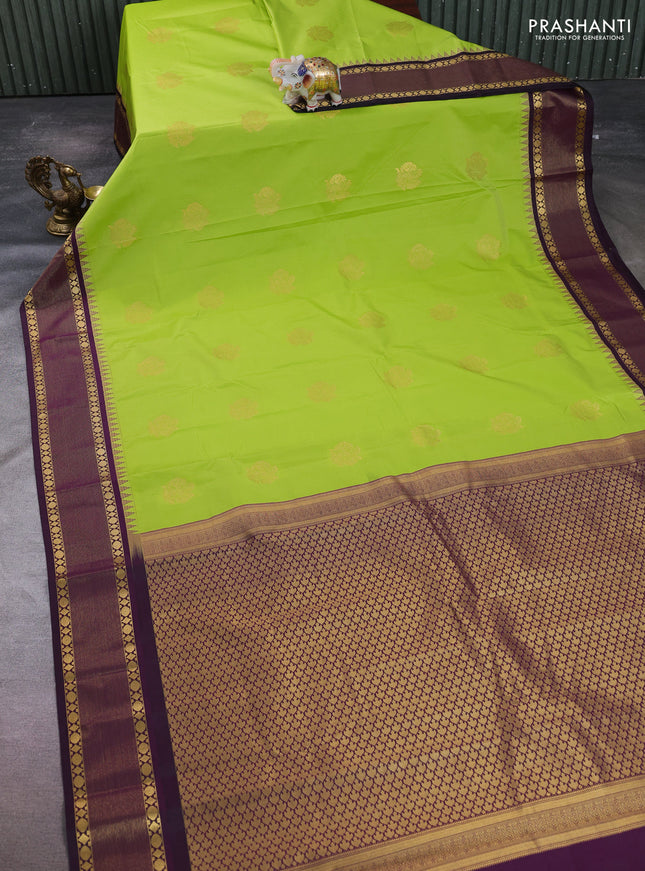 Semi kanchipuram silk saree light green and deep purple with zari woven buttas and temple design zari woven korvai border