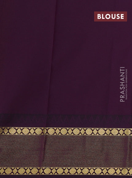 Semi kanchipuram silk saree light green and deep purple with zari woven buttas and temple design zari woven korvai border