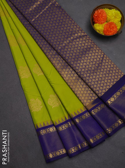 Semi kanchipuram silk saree fluorescent green and blue with zari woven buttas and temple design zari woven border