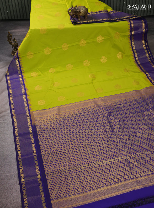 Semi kanchipuram silk saree fluorescent green and blue with zari woven buttas and temple design zari woven border