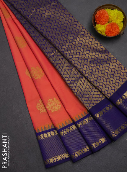 Semi kanchipuram silk saree dual shade of pinkish orange and navy blue with zari woven buttas and temple design zari woven border