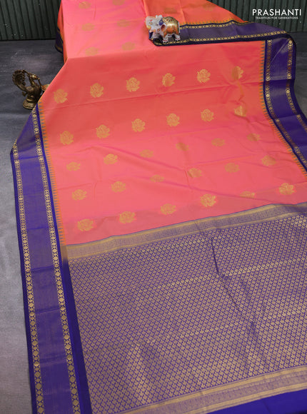 Semi kanchipuram silk saree dual shade of pinkish orange and navy blue with zari woven buttas and temple design zari woven border