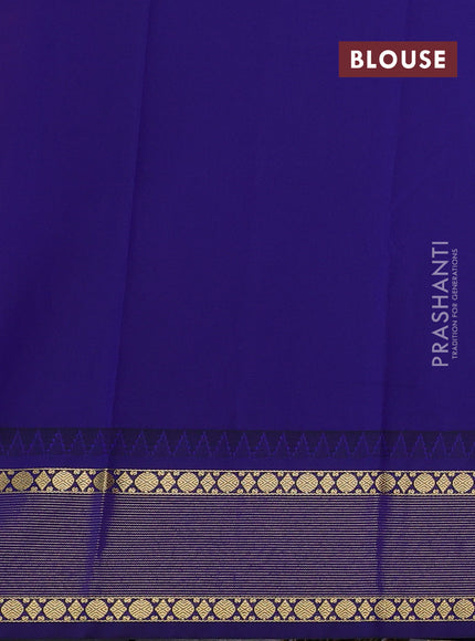 Semi kanchipuram silk saree dual shade of pinkish orange and navy blue with zari woven buttas and temple design zari woven border