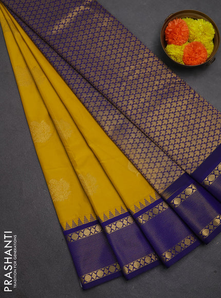 Semi kanchipuram silk saree mustard yellow and blue with zari woven buttas and temple design zari woven border