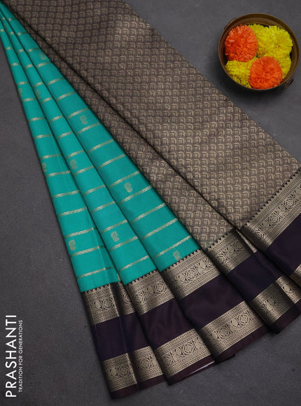 Semi kanchipuram silk saree teal green and deep jamun with allover zari weaves & buttas and temple design rettapet zari woven korvai border