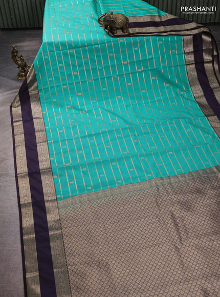 Semi kanchipuram silk saree teal green and deep jamun with allover zari weaves & buttas and temple design rettapet zari woven korvai border