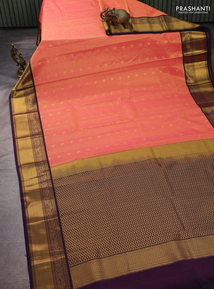 Semi kanchipuram silk saree dual shade of pinkish orange and deep purple with allover zari checks & buttas and temple design rich zari woven border