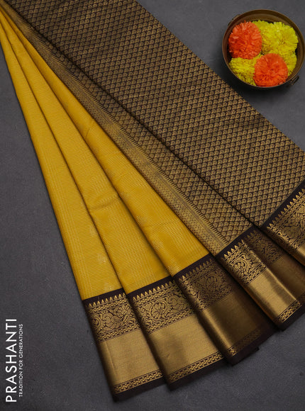 Semi kanchipuram silk saree mustard yellow and coffee brown with allover zari checks & buttas and temple design rich zari woven border