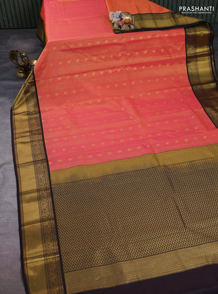 Semi kanchipuram silk saree dual shade of pinkish orange and coffee brown with allover zari checks & buttas and temple design rich zari woven border