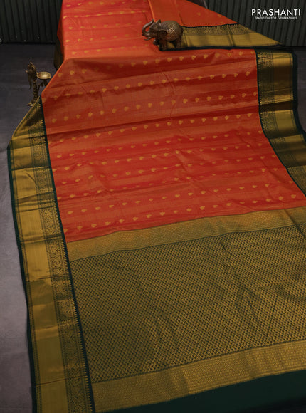 Semi kanchipuram silk saree rust shade and bottle green with allover small zari checks & buttas and temple design rich zari woven korvai border