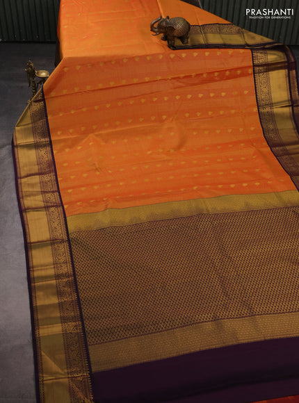 Semi kanchipuram silk saree orange and deep purple with allover small zari checks & buttas and temple design rich zari woven korvai border