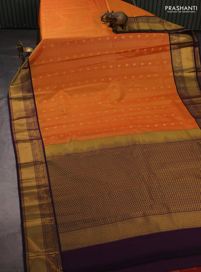 Semi kanchipuram silk saree orange and deep purple with allover small zari checks & buttas and temple design rich zari woven korvai border