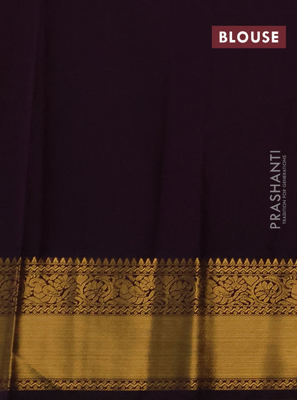 Semi kanchipuram silk saree orange and deep purple with allover small zari checks & buttas and temple design rich zari woven korvai border