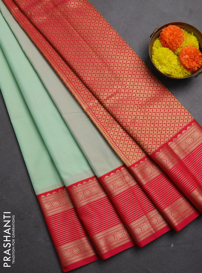 Semi kanchipuram silk saree mild teal green and pink with zari woven buttas and temple desgin zari woven korvai border