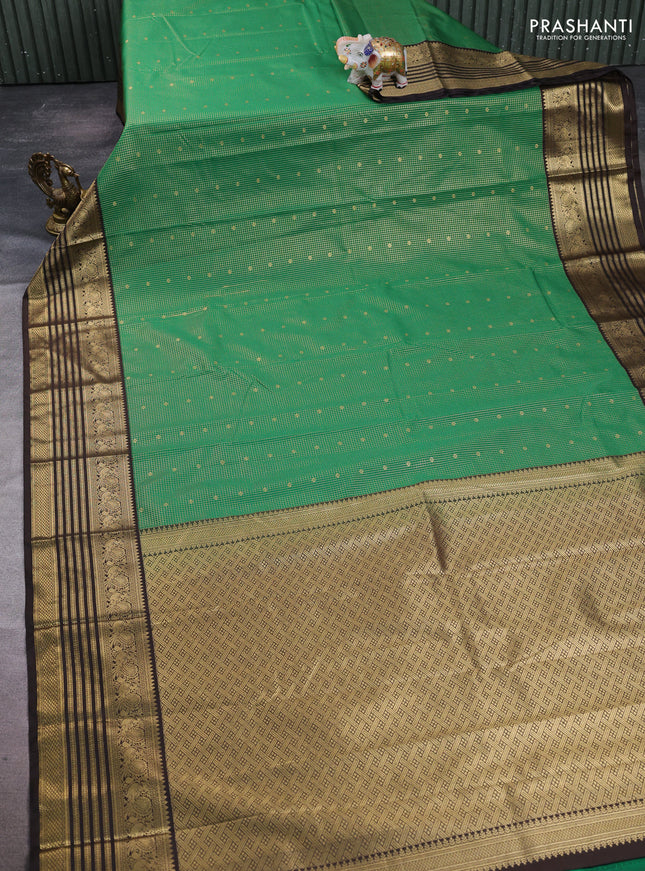 Semi kanchipuram silk saree green and coffee brown with allover small zari checks & buttas and temple desgin zari woven border
