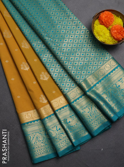 Semi kanchipuram silk saree mustard yellow and teal green with allover zari woven buttas and long zari woven border