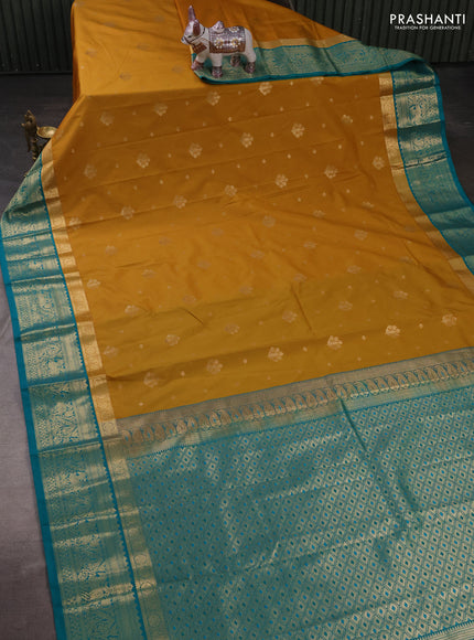 Semi kanchipuram silk saree mustard yellow and teal green with allover zari woven buttas and long zari woven border