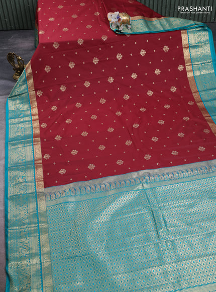 Semi kanchipuram silk saree maroon and teal green with allover zari woven buttas and long zari woven border