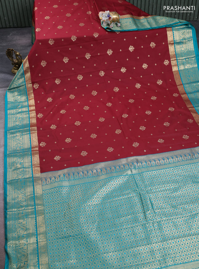 Semi kanchipuram silk saree maroon and teal green with allover zari woven buttas and long zari woven border