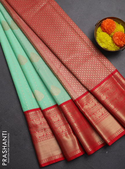 Semi kanchipuram silk saree mild teal green and red with allover zari woven 1000 buttas and long rich zari woven korvai border