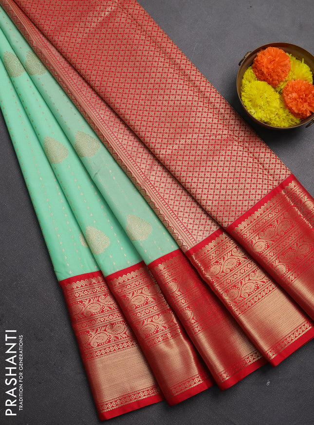 Semi kanchipuram silk saree mild teal green and red with allover zari woven 1000 buttas and long rich zari woven korvai border