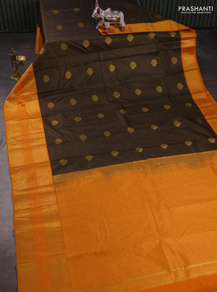 Semi kanchipuram silk saree black and mustard yellow with allover zari checks & buttas and long zari woven korvai border