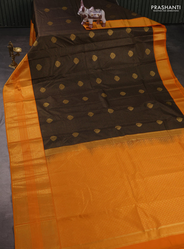 Semi kanchipuram silk saree black and mustard yellow with allover zari checks & buttas and long zari woven korvai border