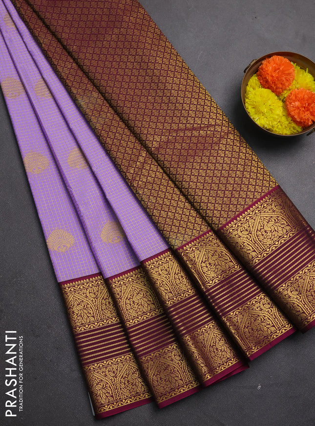 Semi kanchipuram silk saree lavender and dark magenta pink with allover zari checks & buttas and long zari woven korvai border