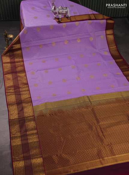 Semi kanchipuram silk saree lavender and dark magenta pink with allover zari checks & buttas and long zari woven korvai border