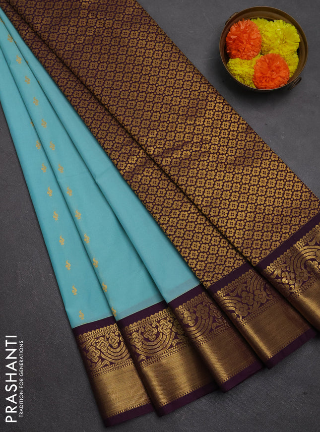 Semi kanchipuram silk saree teal blue and deep purple with allover zari woven buttas and rich zari woven border