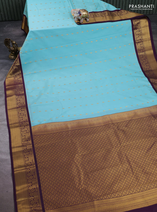Semi kanchipuram silk saree teal blue and deep purple with allover zari woven buttas and rich zari woven border