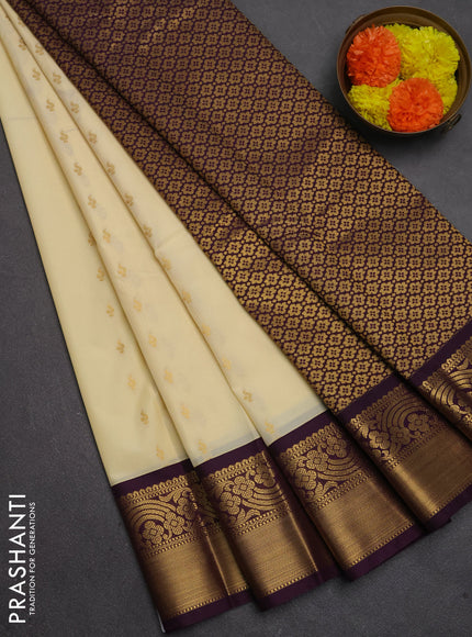Semi kanchipuram silk saree cream and purple with allover zari woven buttas and rich zari woven border