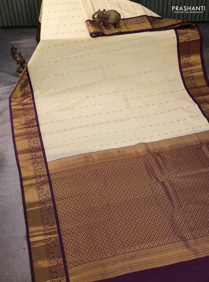 Semi kanchipuram silk saree cream and purple with allover zari woven buttas and rich zari woven border